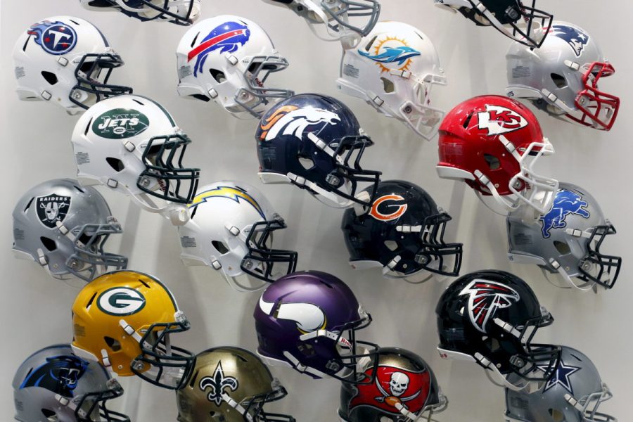 NFL+team+helmets+are+displayed+at+the+NFL+Headquarters+in+New+York+December+3%2C+2015.+An+impact+absorbing+helmet%2C+a+cushion+for+artificial+turf+and+a+rubberized+tether+that+slows+the+speed+of+the+head+snapping+back+after+a+collision+were+products+named+winners+of+a+research+challenge+co-sponsored+by+the+NFL.+Three+separate+innovation+challenges+are+providing+up+to+%2420+million+in+research+and+technology+development+to+better+understand%2C+identify+and+protect+against+brain+injury.+++REUTERS%2FBrendan+McDermid